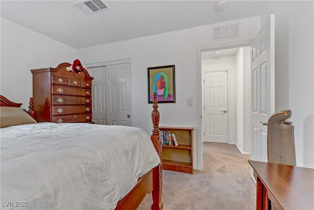 bedroom featuring light carpet and a closet