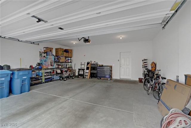 garage featuring a garage door opener