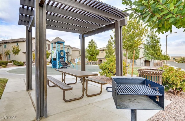 view of patio / terrace featuring a playground and a pergola