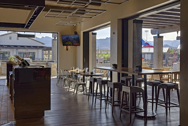 dining area featuring dark wood-type flooring