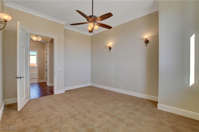 empty room featuring crown molding and ceiling fan