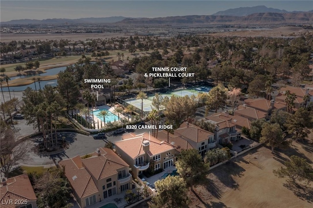 drone / aerial view with a residential view and a mountain view