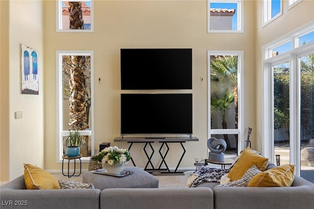 living room with a towering ceiling