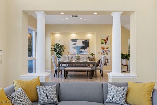 interior space with baseboards, recessed lighting, visible vents, and ornate columns