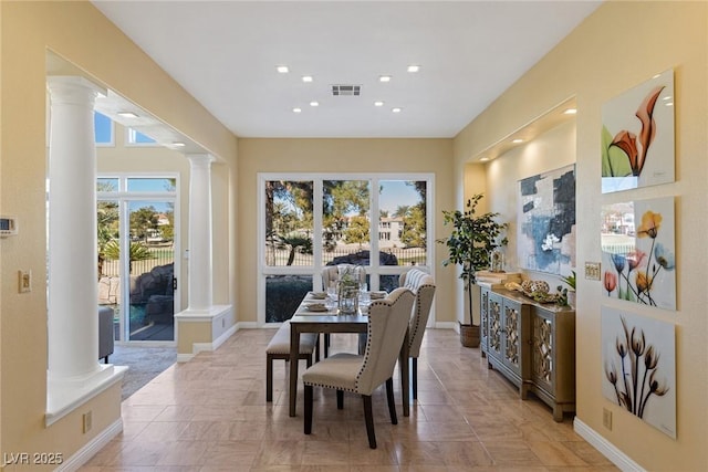 dining space with ornate columns