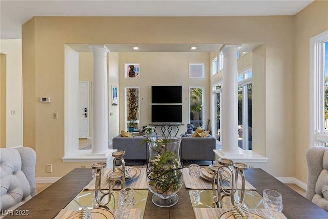 living room with ornate columns