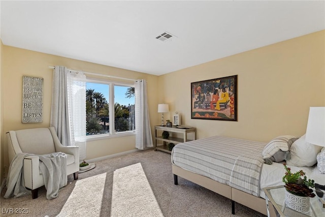 carpeted bedroom with baseboards and visible vents