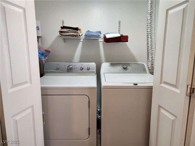 laundry area with washer and clothes dryer