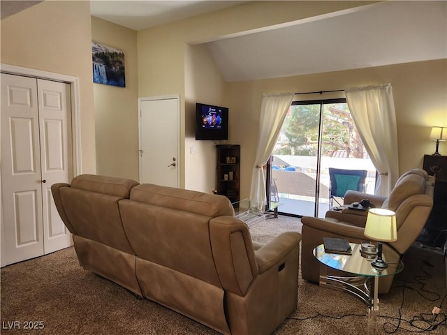 carpeted living room featuring vaulted ceiling