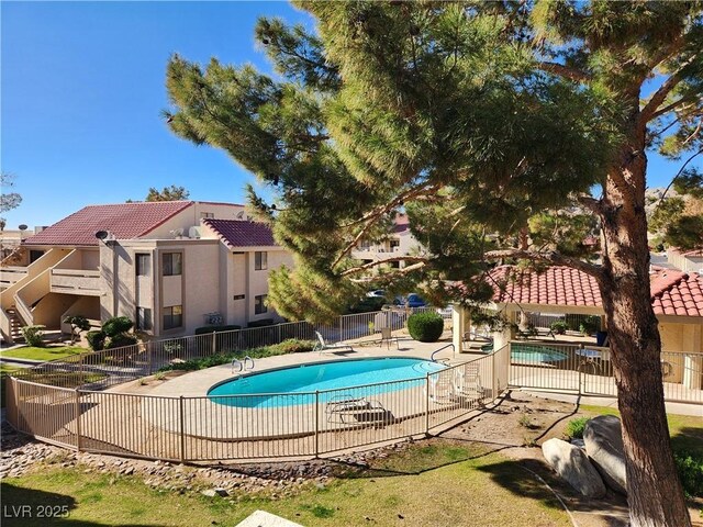 view of swimming pool featuring a patio area