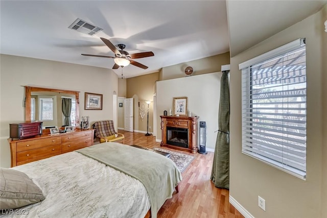 bedroom with ceiling fan and light hardwood / wood-style flooring