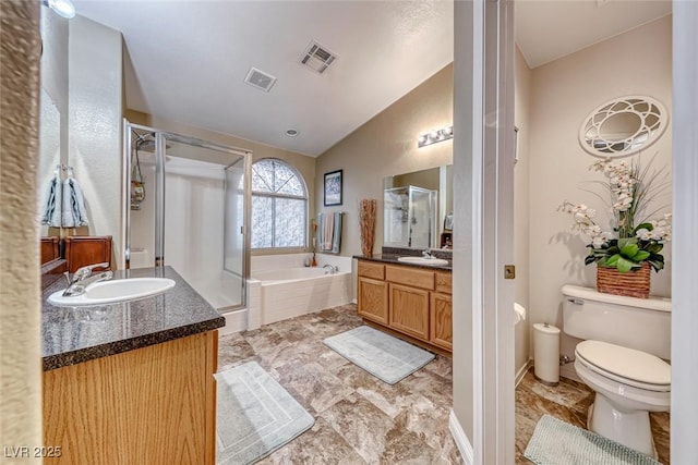 full bathroom featuring vanity, toilet, independent shower and bath, and vaulted ceiling