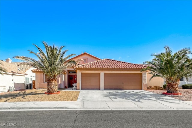 mediterranean / spanish house with a garage and central AC