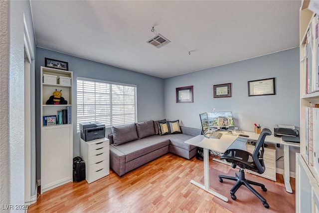 office space with light wood-type flooring