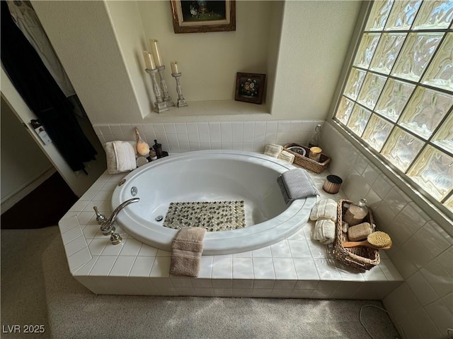 bathroom with tiled tub