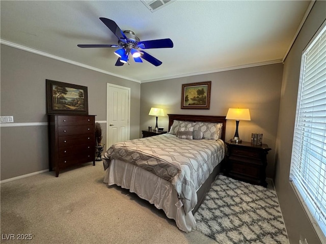 bedroom featuring light carpet, crown molding, and ceiling fan