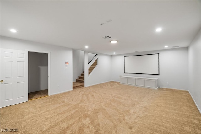 home theater featuring baseboards, visible vents, light colored carpet, and recessed lighting