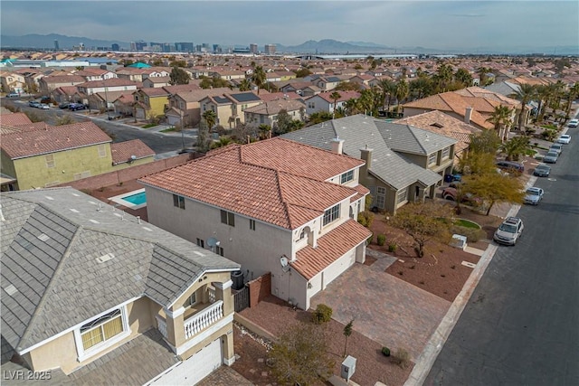 aerial view with a mountain view and a residential view