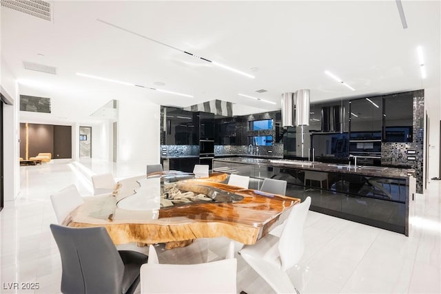 dining room with light tile patterned flooring