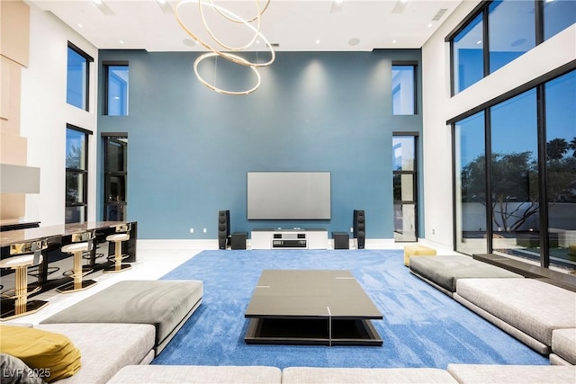 living room featuring a towering ceiling