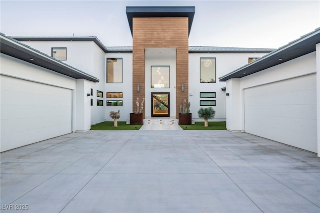 view of exterior entry with a garage