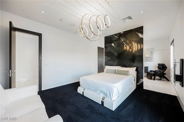 carpeted bedroom with a notable chandelier