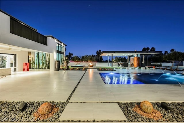 view of pool featuring pool water feature and a patio area