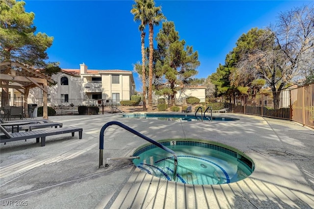 view of pool featuring a hot tub