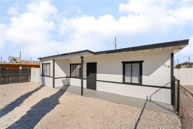 rear view of property featuring a patio