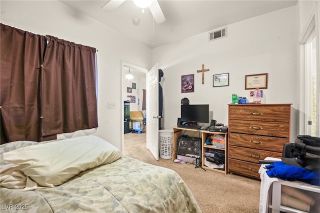 carpeted bedroom with lofted ceiling and ceiling fan