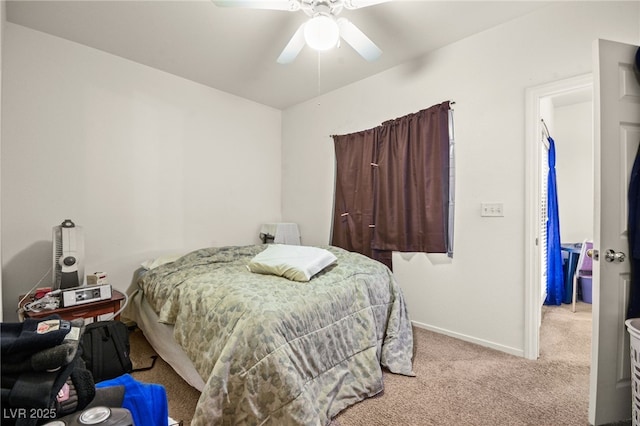 bedroom featuring light colored carpet and ceiling fan