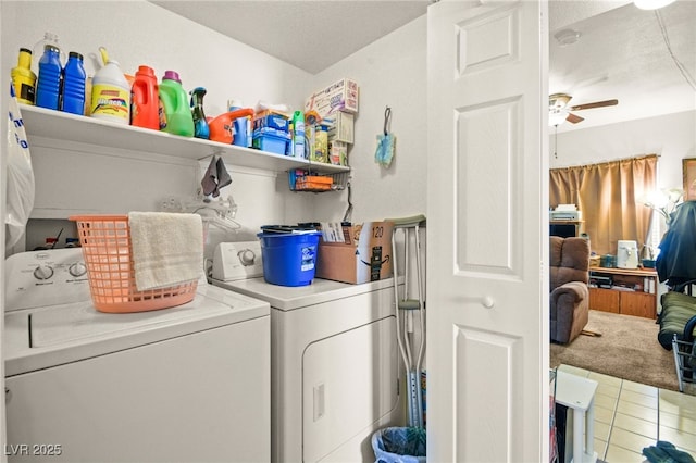 laundry area with ceiling fan, tile patterned floors, and washing machine and clothes dryer