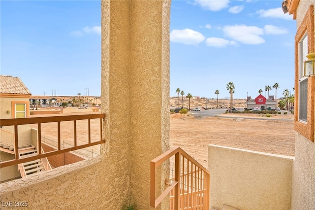 view of yard with a balcony