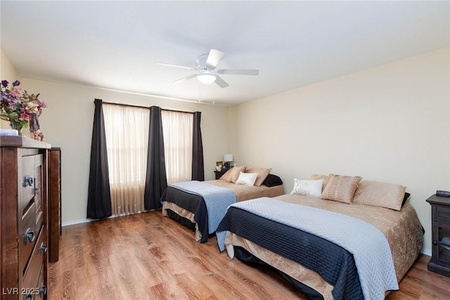 bedroom with hardwood / wood-style flooring and ceiling fan