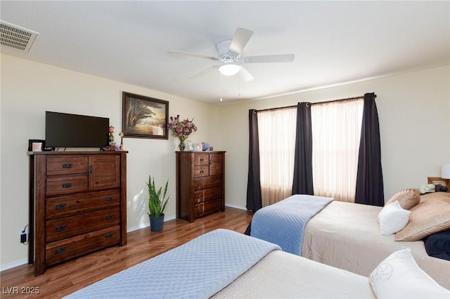 bedroom with hardwood / wood-style flooring and ceiling fan