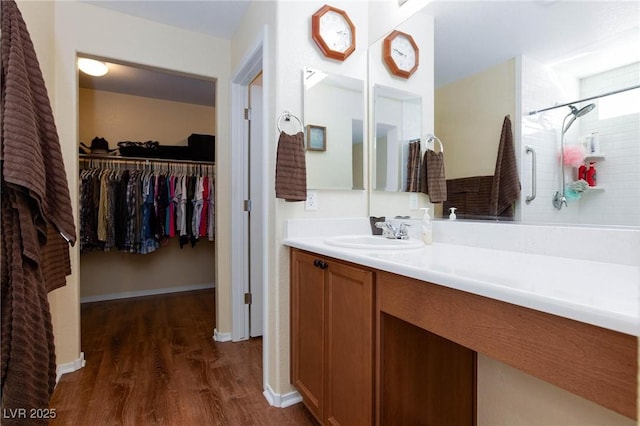 bathroom with hardwood / wood-style flooring and vanity