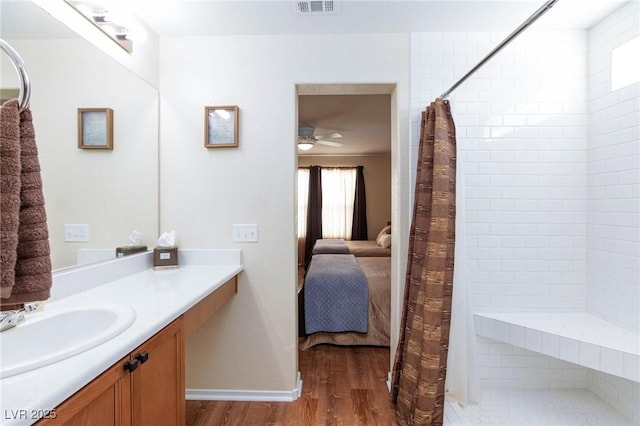 bathroom with vanity, wood-type flooring, ceiling fan, and a shower with shower curtain