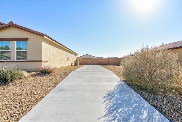 view of side of property featuring a patio area