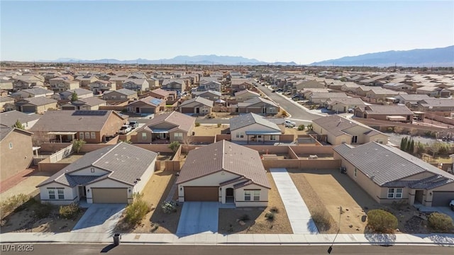 birds eye view of property with a mountain view