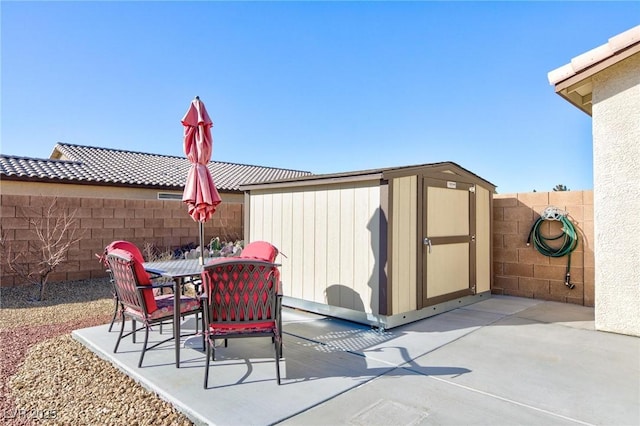 view of patio / terrace featuring a shed