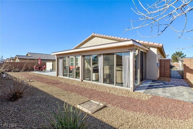 back of house featuring a patio area