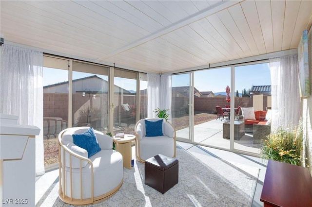 sunroom / solarium with plenty of natural light and wooden ceiling