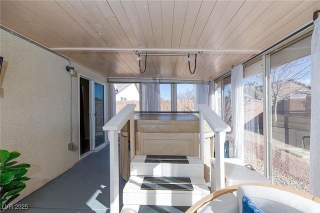 sunroom featuring wooden ceiling