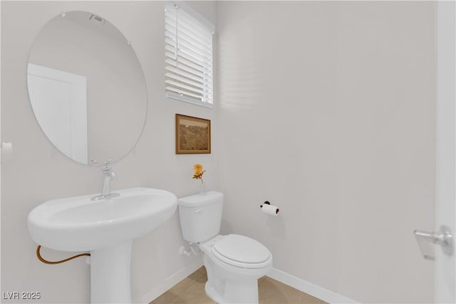 bathroom featuring tile patterned floors and toilet