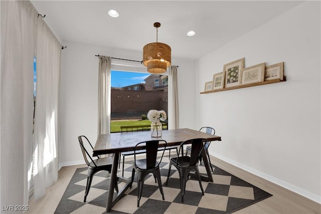 dining space with light hardwood / wood-style flooring