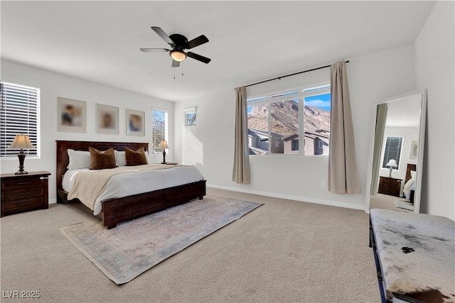 bedroom with light colored carpet and ceiling fan