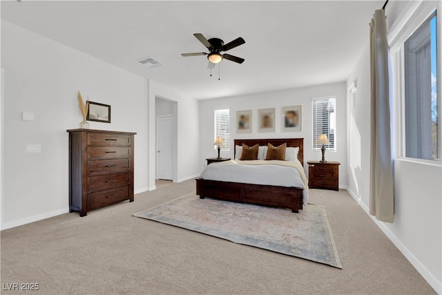 bedroom with light carpet and ceiling fan