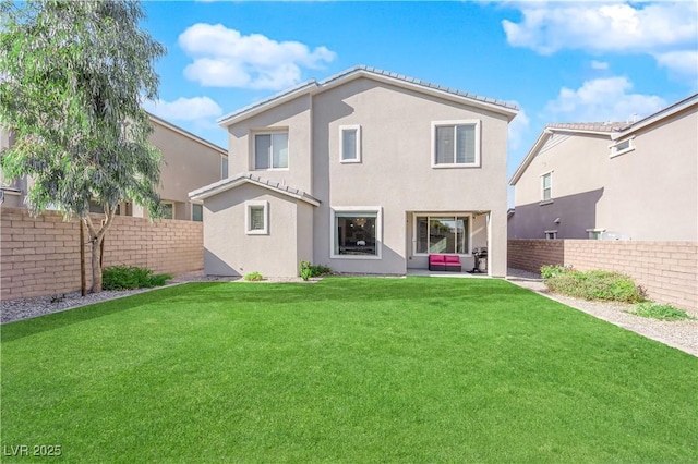 rear view of property with an outdoor living space and a lawn