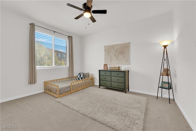 carpeted bedroom featuring ceiling fan