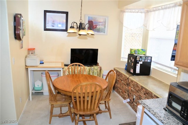 dining room featuring a notable chandelier